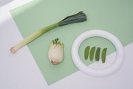 White and Green Sliced Fruit on White Chopping Board