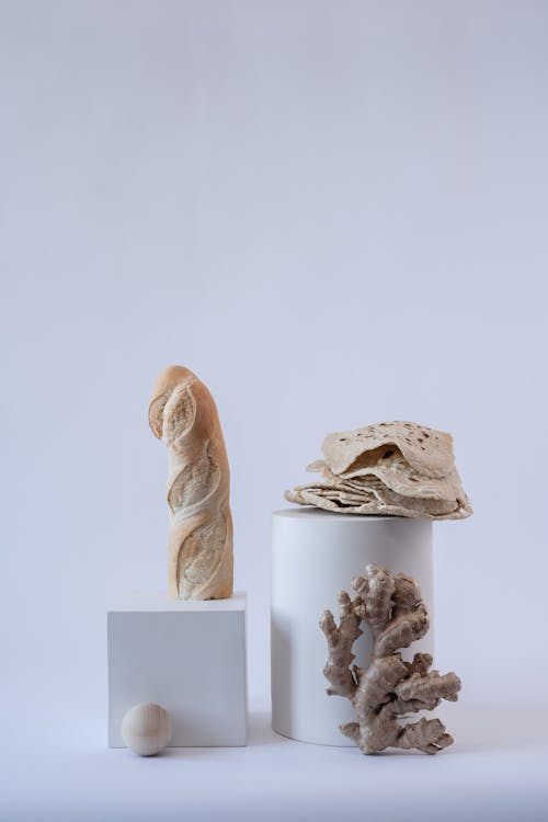 Photo of a Baguette on Top of a Cube