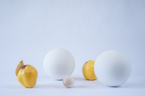 Free Abstract arrangement of quinces and spheres in a minimalist still life composition. Stock Photo