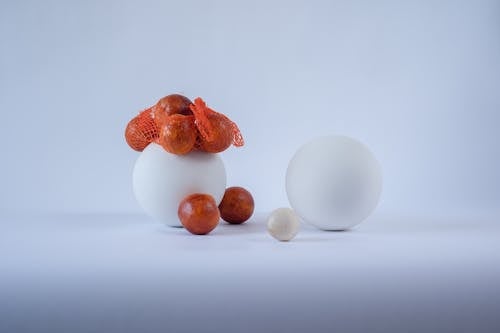 Oranges Beside White Ball