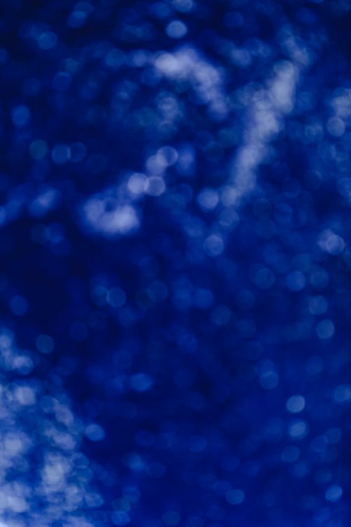 Free Abstract blue bokeh background with a blurry glitter effect, ideal for creative projects. Stock Photo