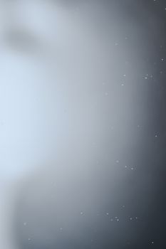 A blurred abstract background with soft lighting and a foggy appearance, perfect for design use.