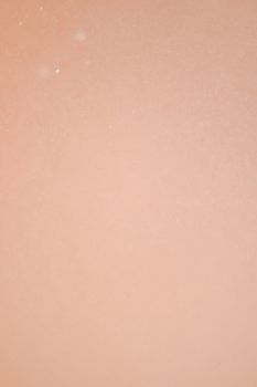 Pastel orange background with subtle bubbles, ideal for creative designs.