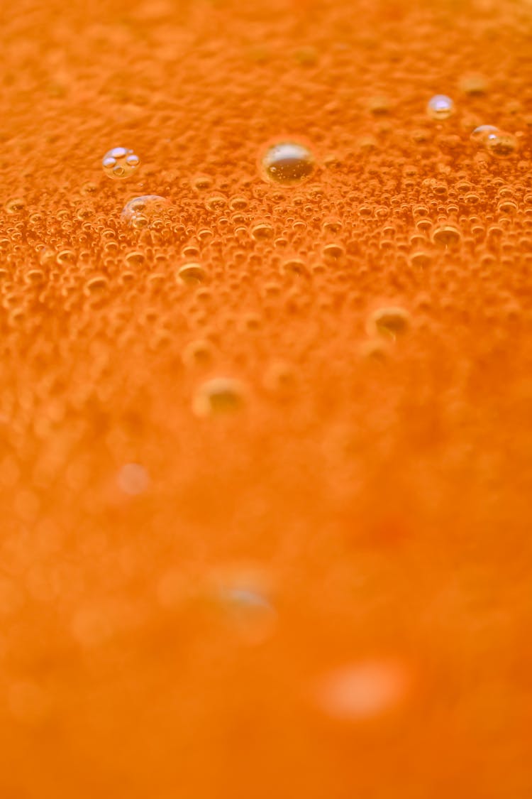 Bubbles On Juice Surface