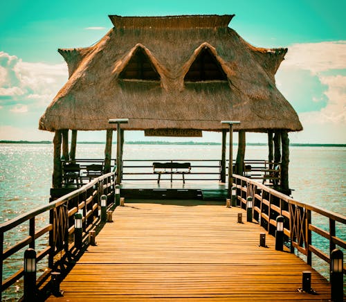 Brown Wooden Hut On Pier