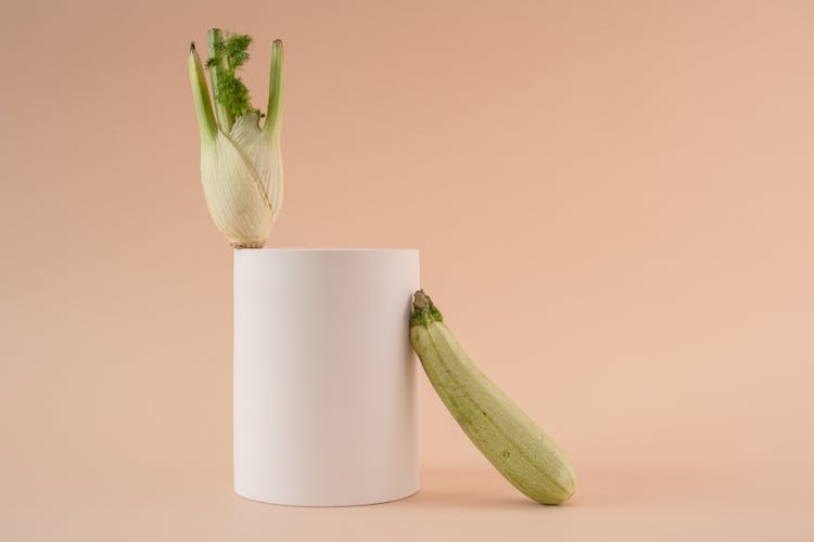 Green Vegetable On White Ceramic Vase