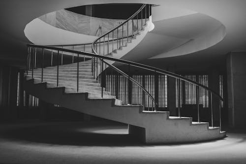 Grayscale Photo of a Spiral Staircase