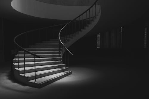 A Spiral Staircase in Black and White Photo