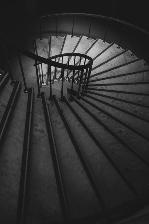 Free A dramatic view of a spiral staircase in İstanbul captured in black and white, showcasing modern architecture. Stock Photo