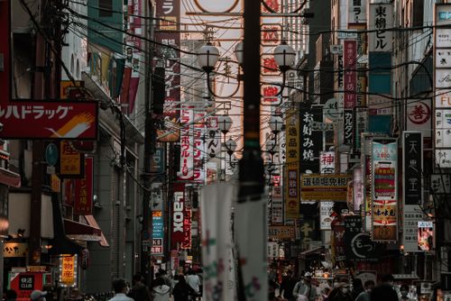 Free Explore the vibrant urban landscape of Osaka with bustling streets filled with colorful signages. Stock Photo