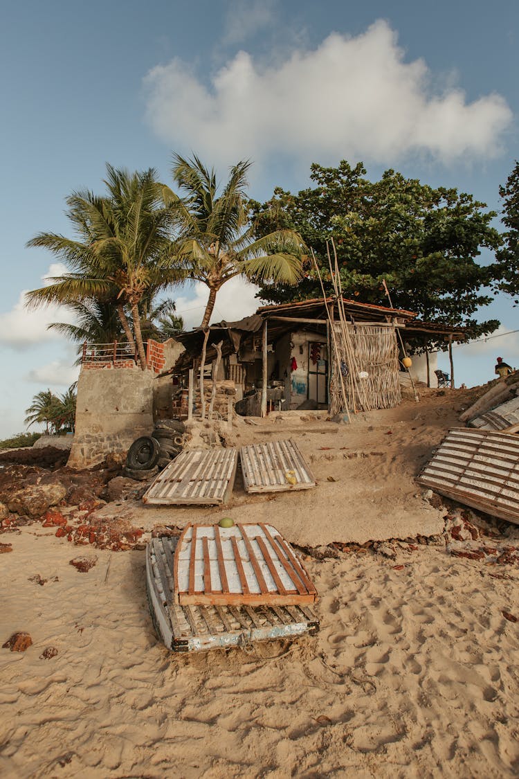 Old Abandoned House Placed On Tropical Beach In Sunny Day