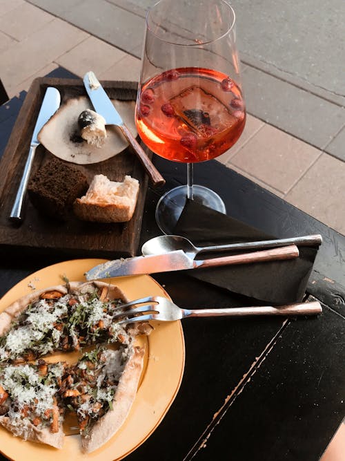 Free Top View of Wine and Pizza on a Dining Table Stock Photo