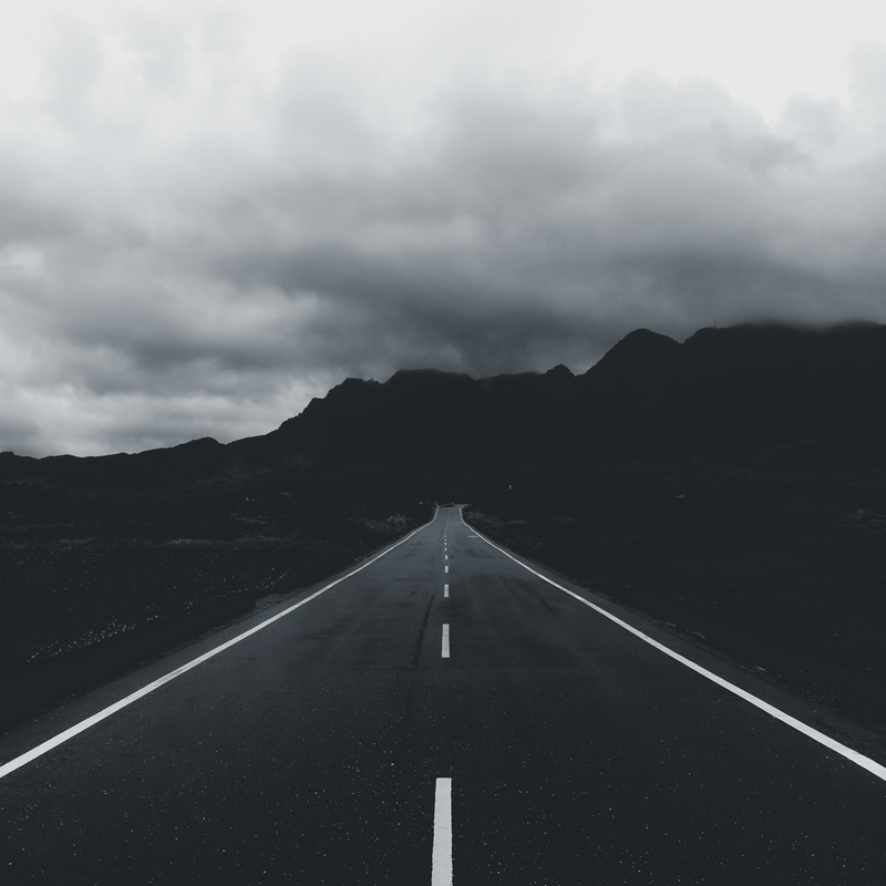 Blurred cover artwork — mountain road photo by Laros Lin on Pexels