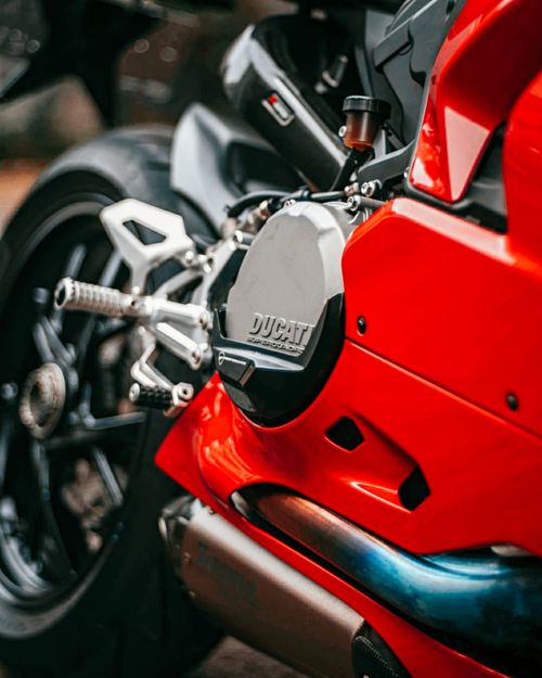 Free Detailed close-up of a classic red Ducati motorcycle, showcasing engine and design. Stock Photo