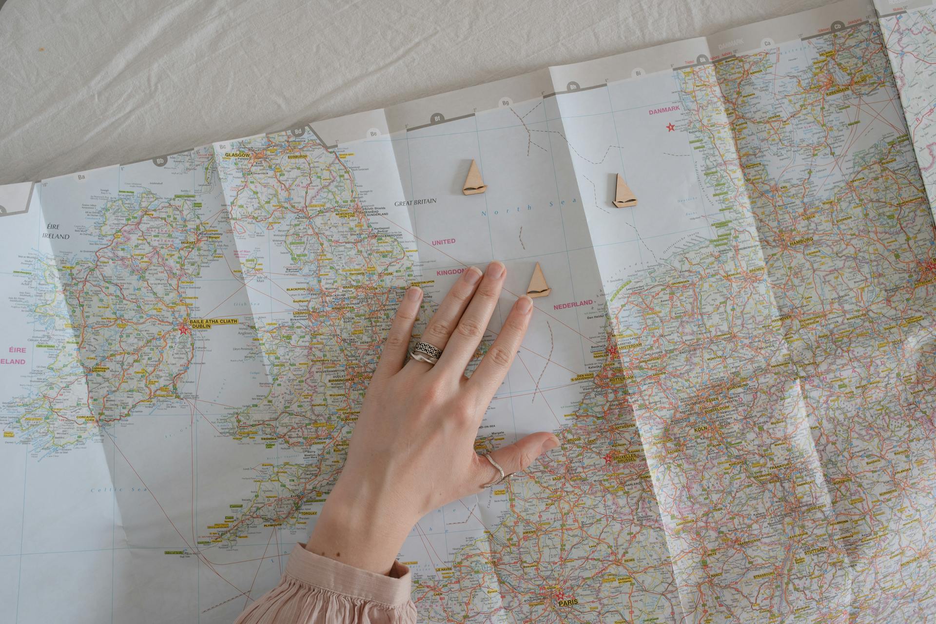 A Woman's Hand over a Map