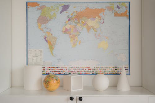 A World Map and a Globe in a Shelf