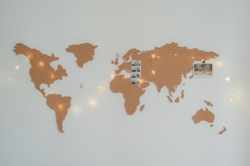 Brown Map on the Wall with Fairy Lights and Photos