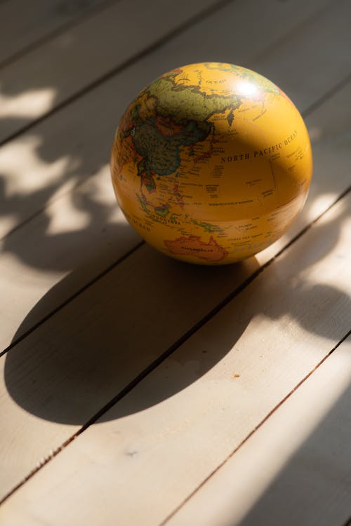 A Globe on a Wooden Surface 