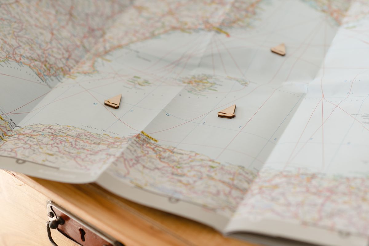 Folded paper charts on a table, photo by Marina Leonova on Pexels
