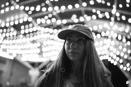 Free Grayscale Photo of a Woman Wearing Cap Stock Photo