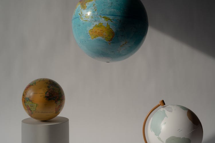 Blue And Brown Globe On White Table