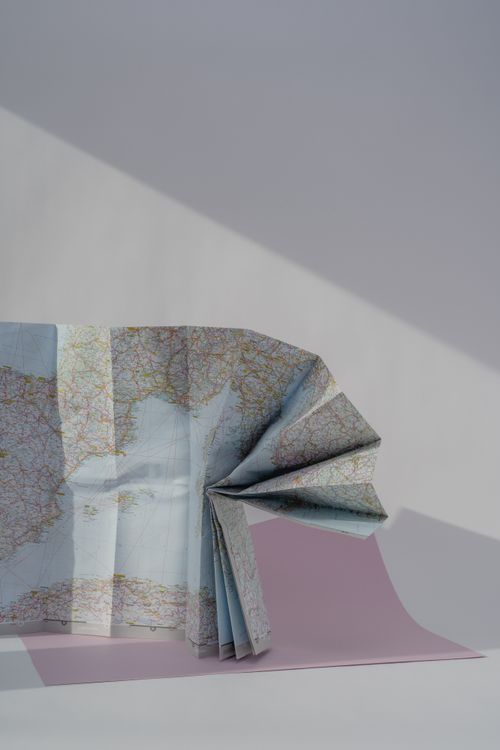 Wrapped Map Half-Wrapped Map on Pink Paper · Free Stock Photo