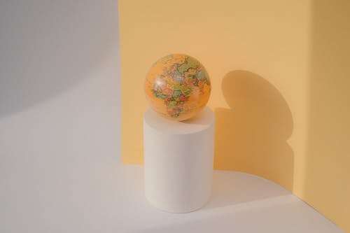 Earth Globe on White Cylinder