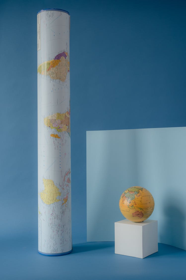 A Globe And A Tube Map On Blue Surface