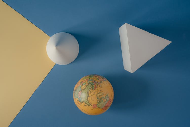 World Globe On Yellow And Blue Background  