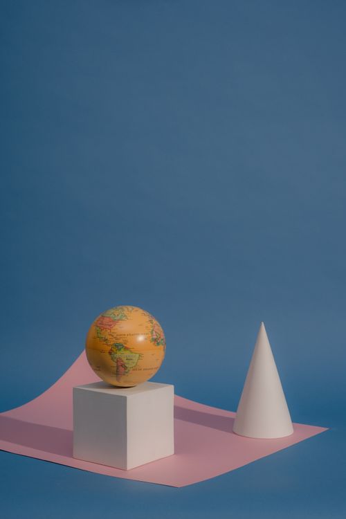 Free Colorful globe and geometric figures on a modern background. Stock Photo