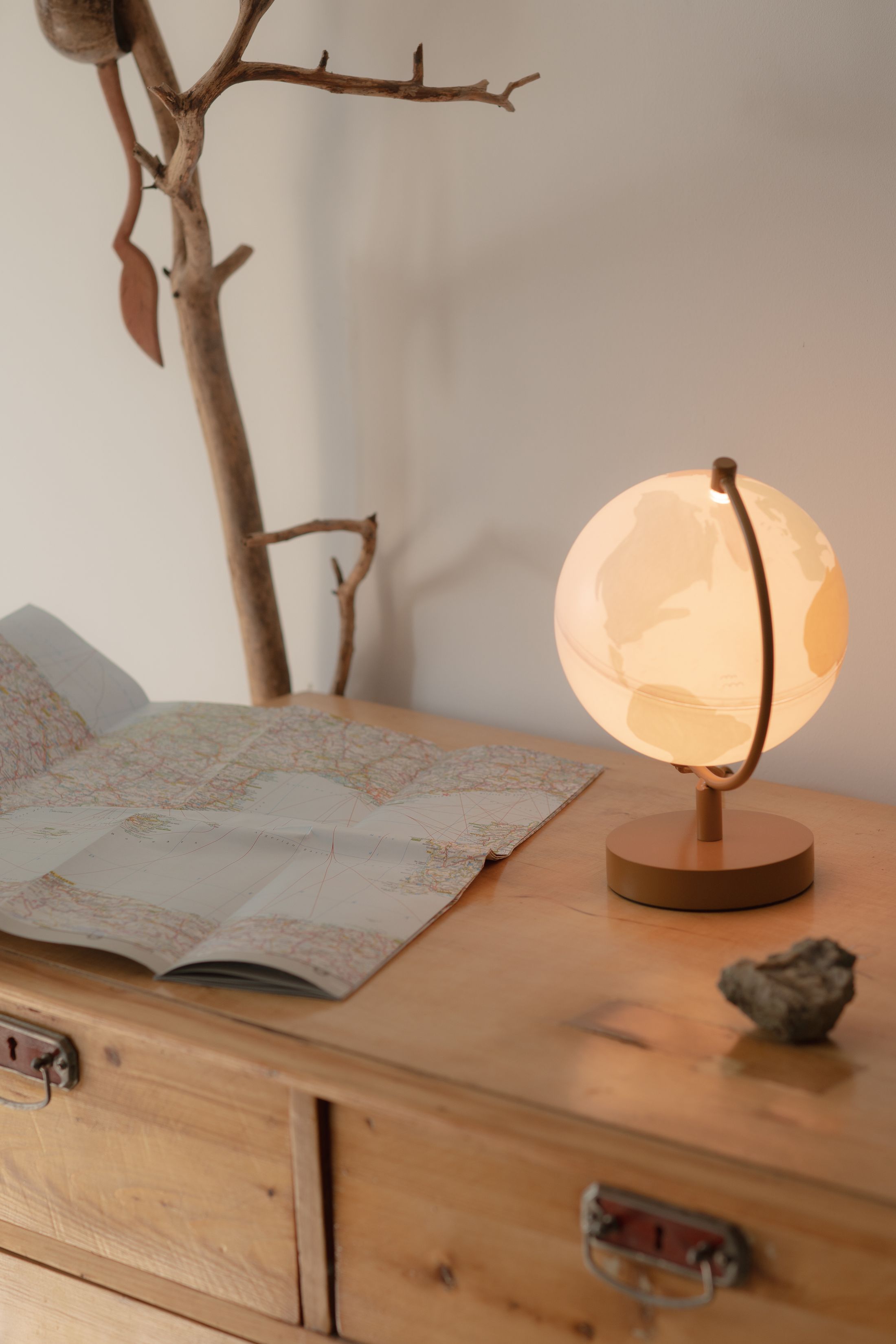Context photograph: A map beside an illuminated globe. Not a VIEWPIECE acquisition or analysis.
