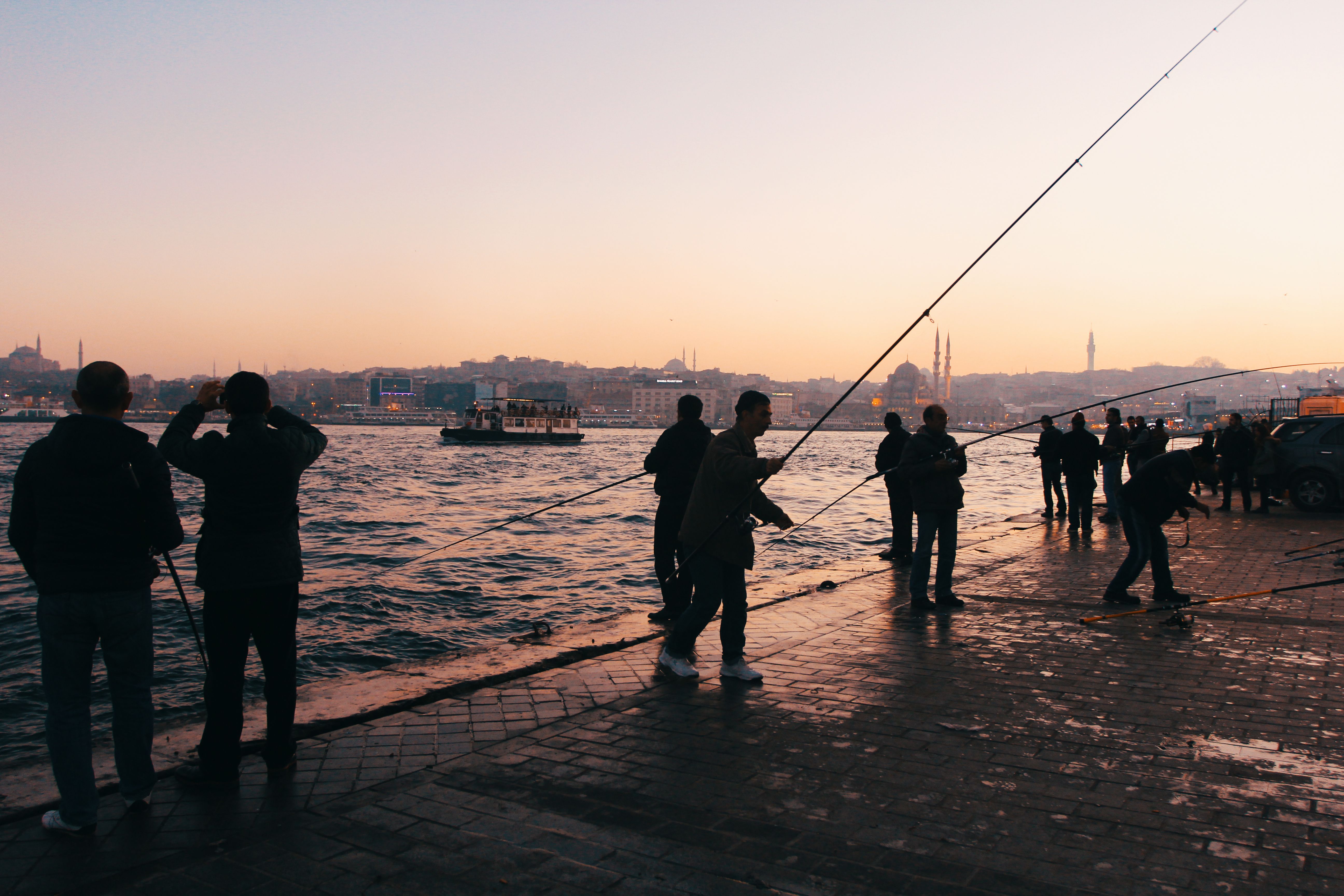 Group of People Fishing on Riverbank · Free Stock Photo