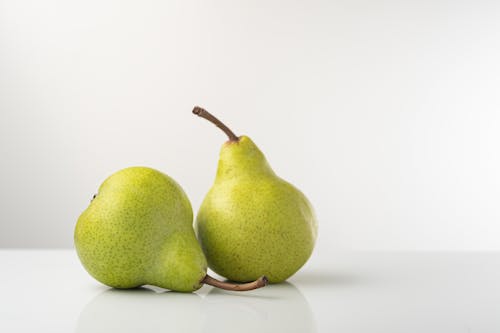 Free Photo of Two Pears with Brown Stems Stock Photo