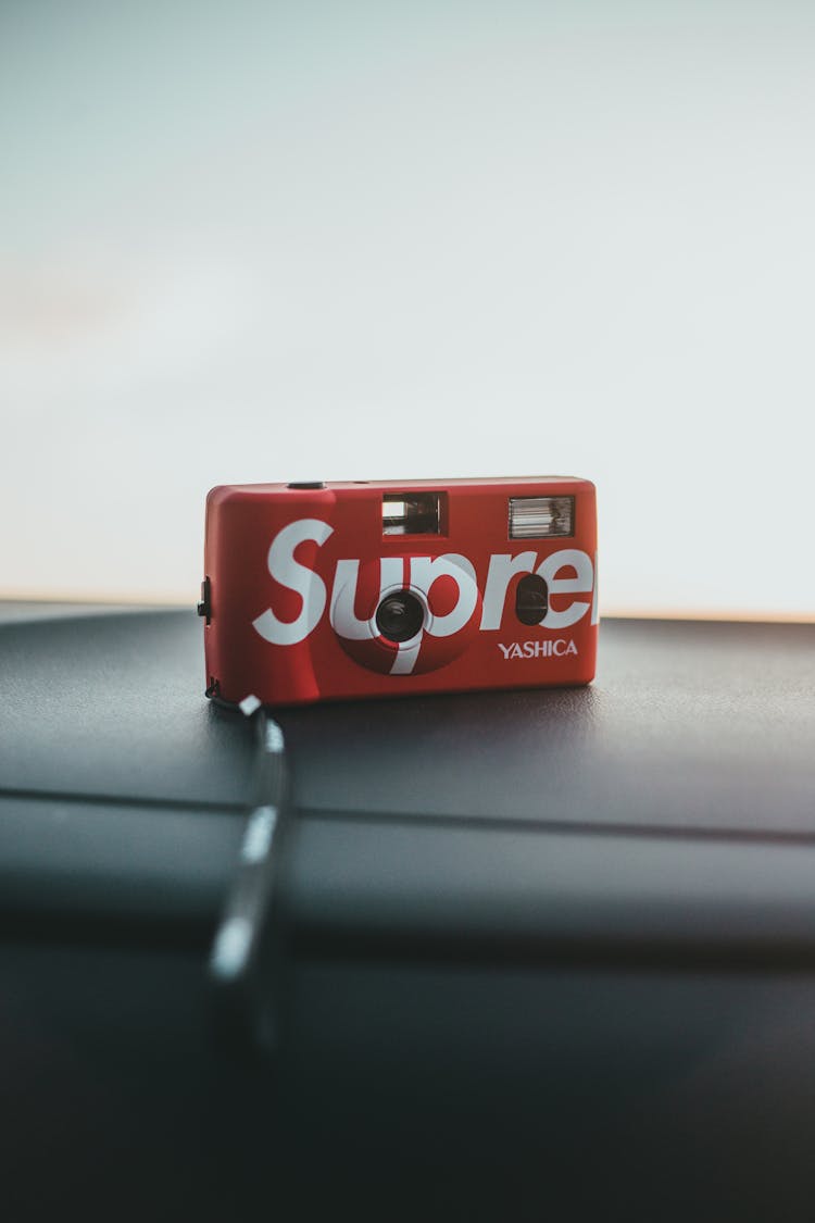 Photo Of A Retro Camera With Supreme Sticker