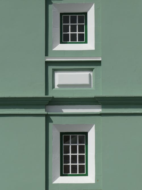 Windows of a Green Concrete Building