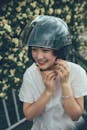 Woman in White Blouse Wearing Black Helmet