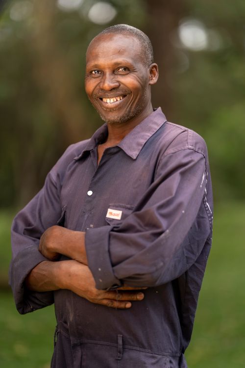 Free A cheerful elderly man smiling confidently outdoors in Arusha, Tanzania. Stock Photo
