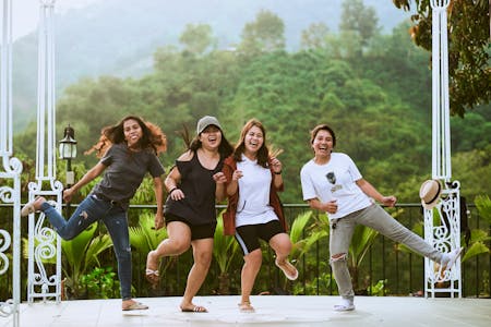 Group of friends laughing together outdoors