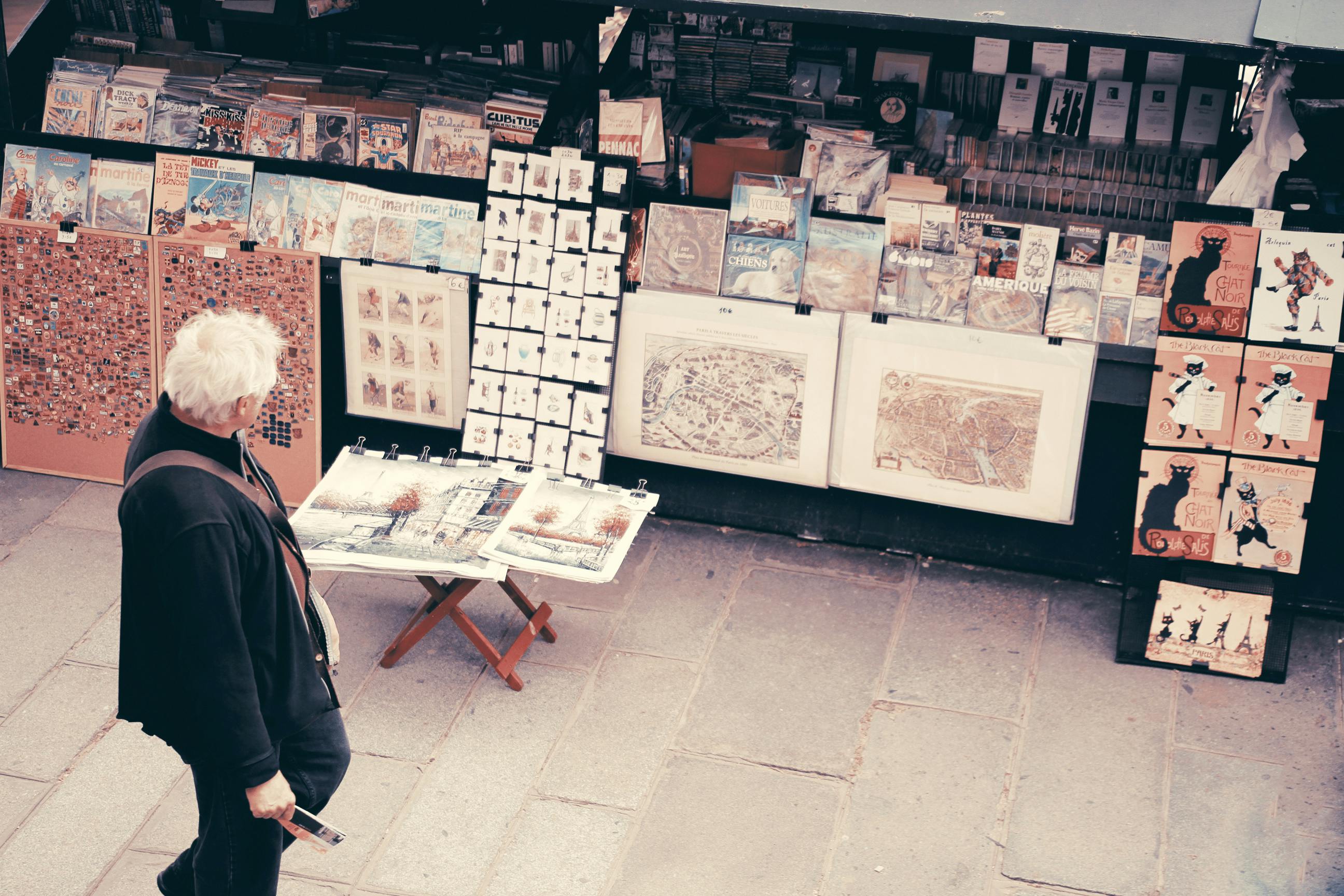 photo of an old man looking at the pictures