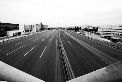 Grayscale Photo of an Empty Road