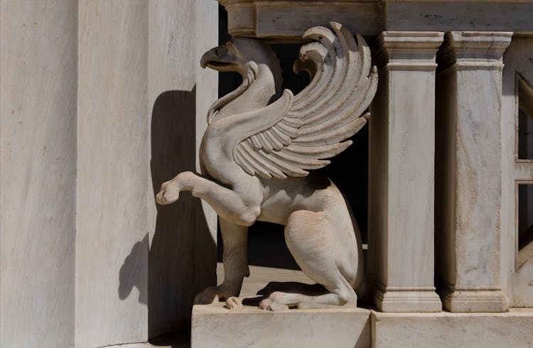 Close-up Of A Griffin Statue On A Building Facade 