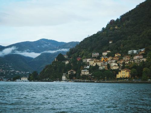 Free Picturesque landscape of Lake Como with colorful houses nestled on verdant hillsides. Stock Photo