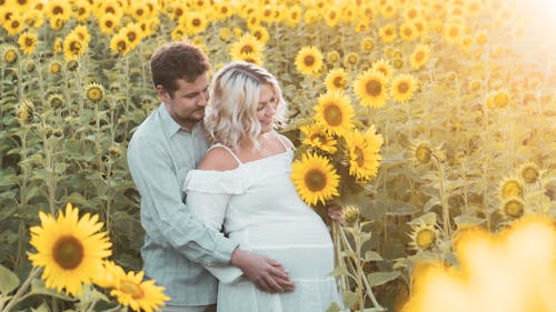 A Couple on a Sunflower Field 