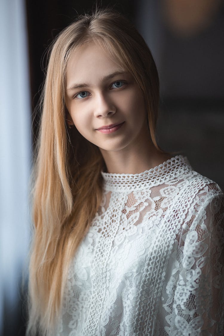 Teenage Girl With Long Hair Wearing White Blouse