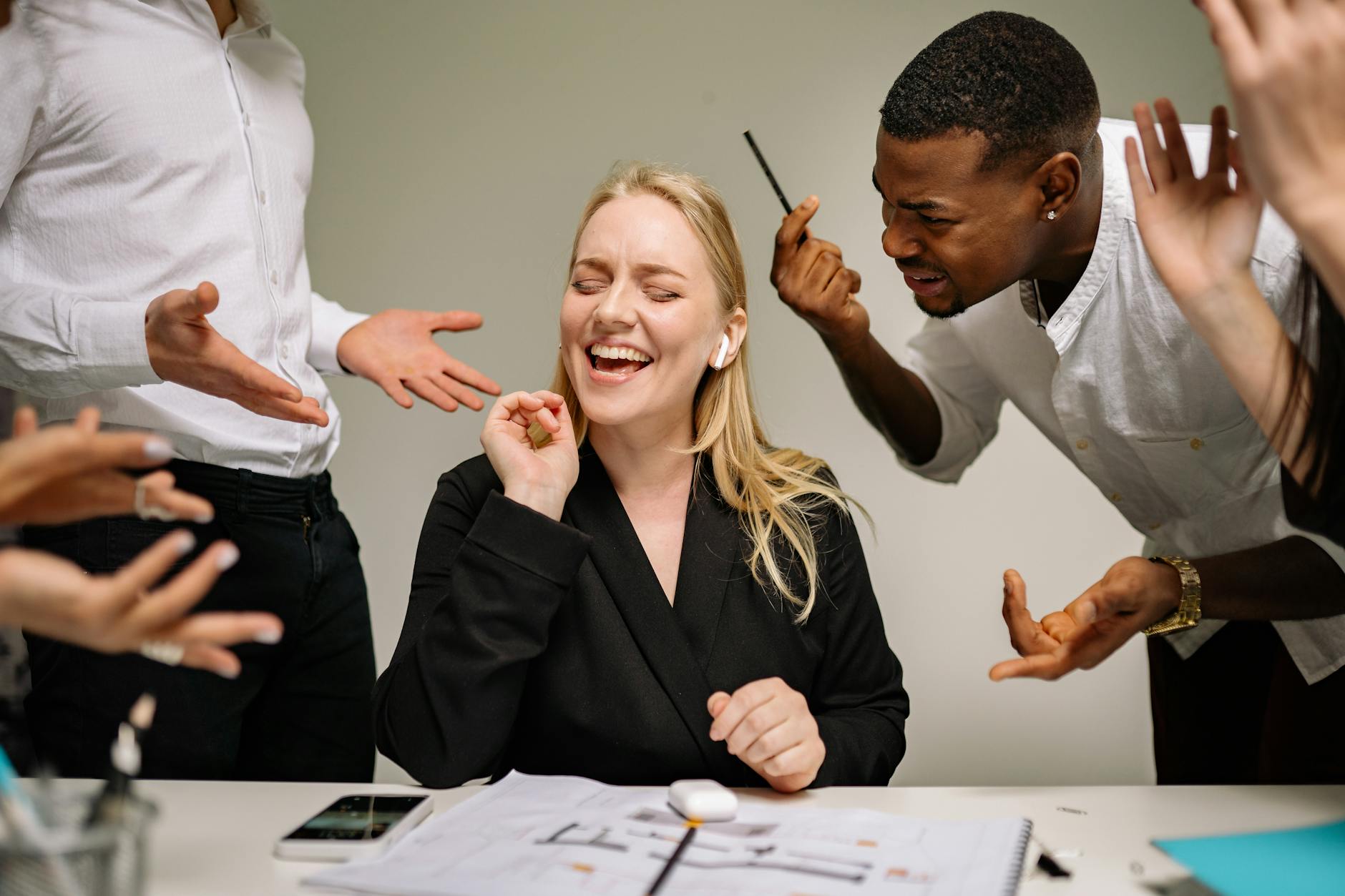 Conceptual image of office conflict with a woman facing workplace pressure surrounded by colleagues.
