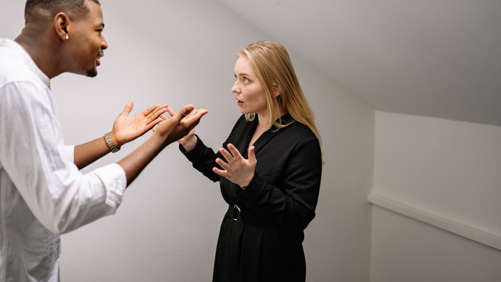 A man and woman in serious discussion