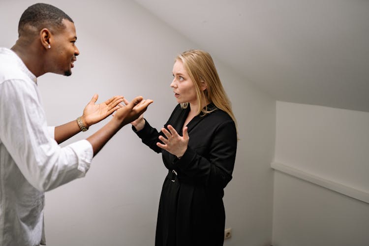 A Man And Woman Arguing Each Other 