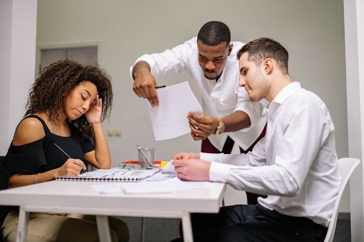 Three People Working In The Office