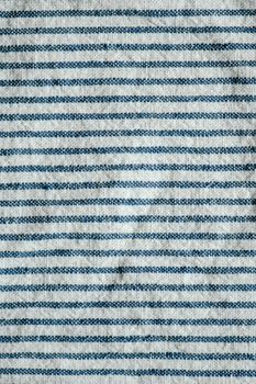 Close-up of a blue and white striped fabric pattern, ideal for textile design and background use.