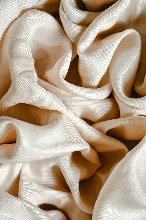 Ruffled White Textile in Close Up Photography